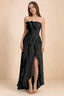 Front studio view of Camilla black strapless maxi dress with pleats, cascading ruffles and an asymmetric opening