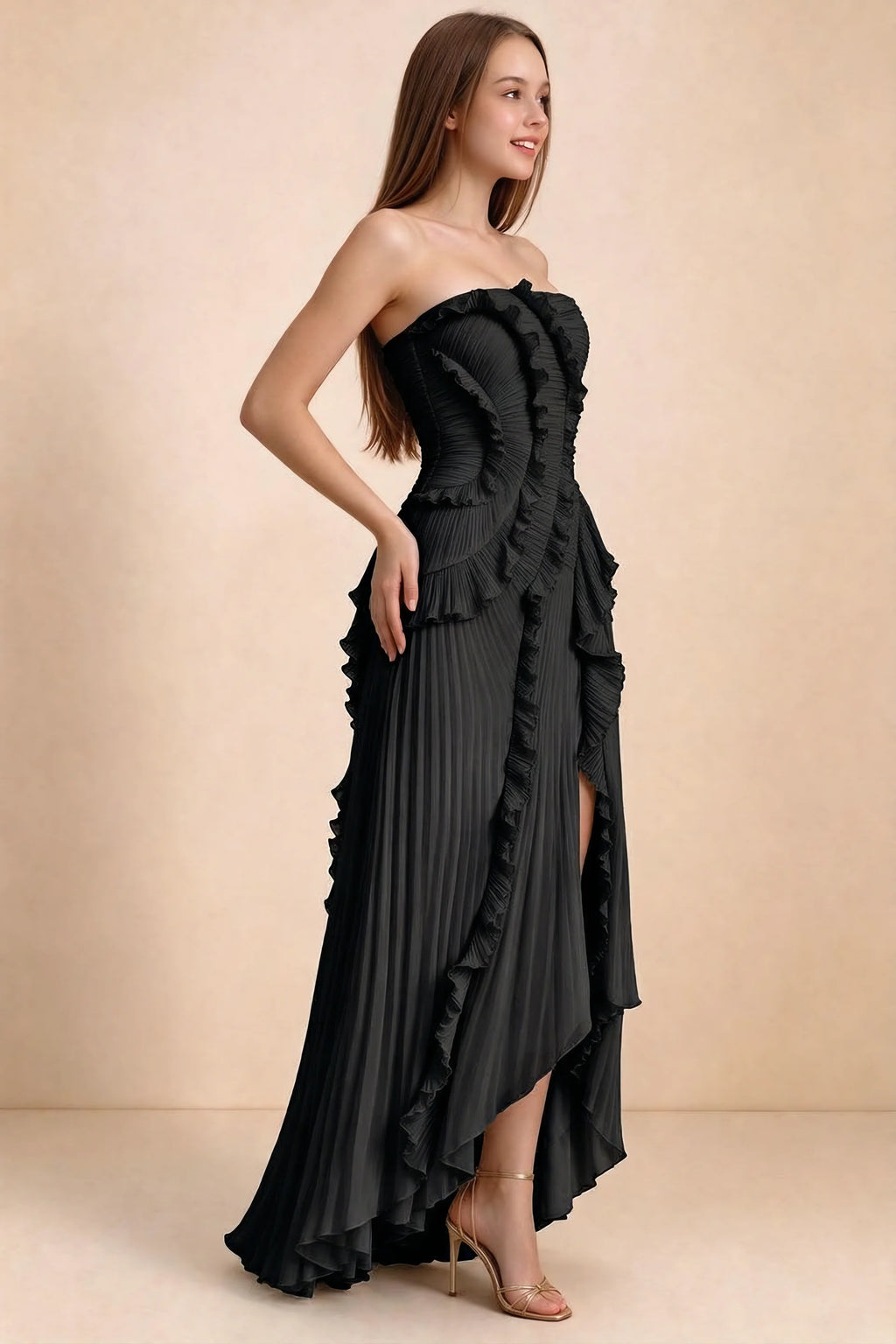 Three-quarter studio view of Camilla black dress showing the defined waist and asymmetric leg opening