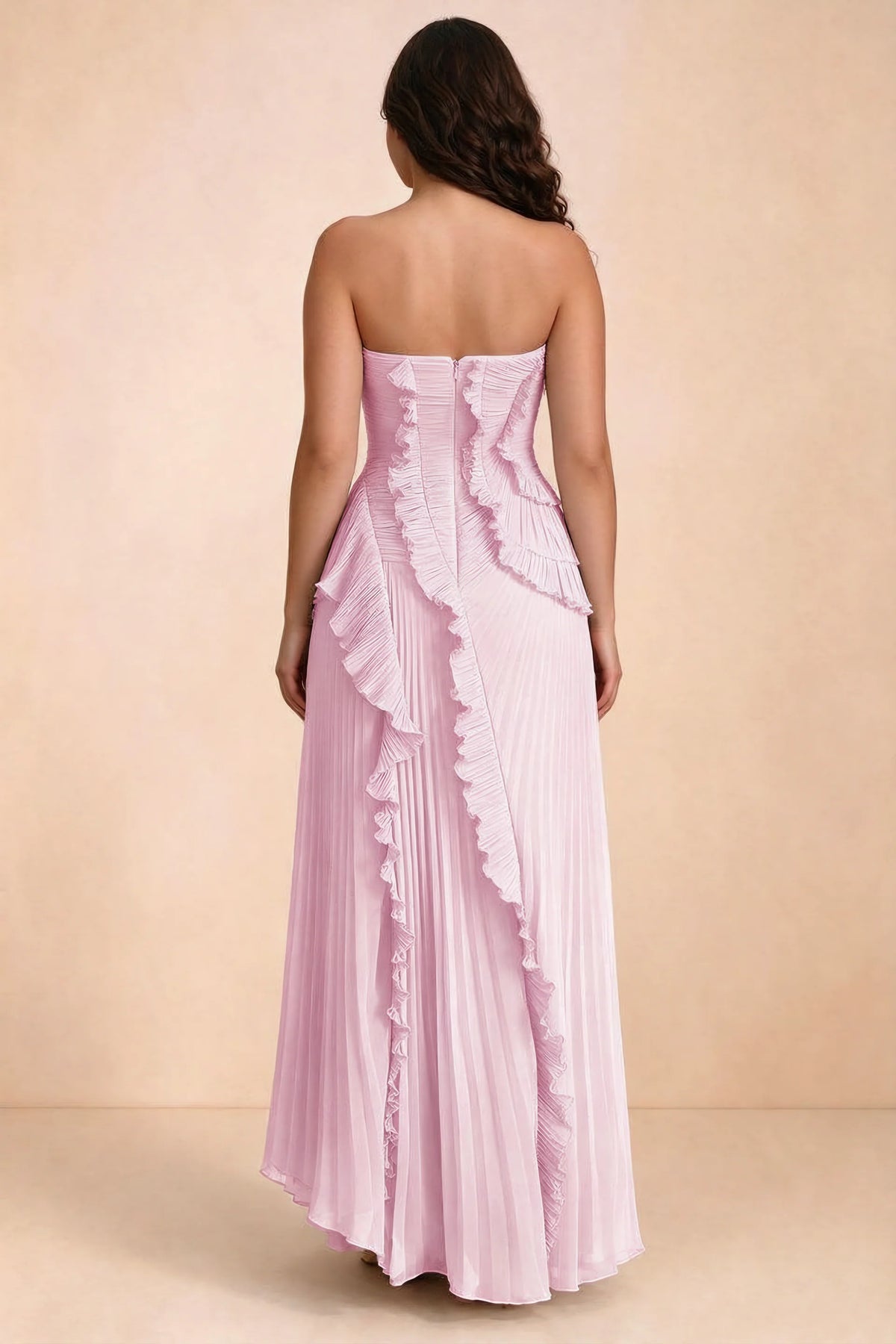 Rear studio view of Camilla candy dress on a second model, showing the ruffled back and pleated skirt