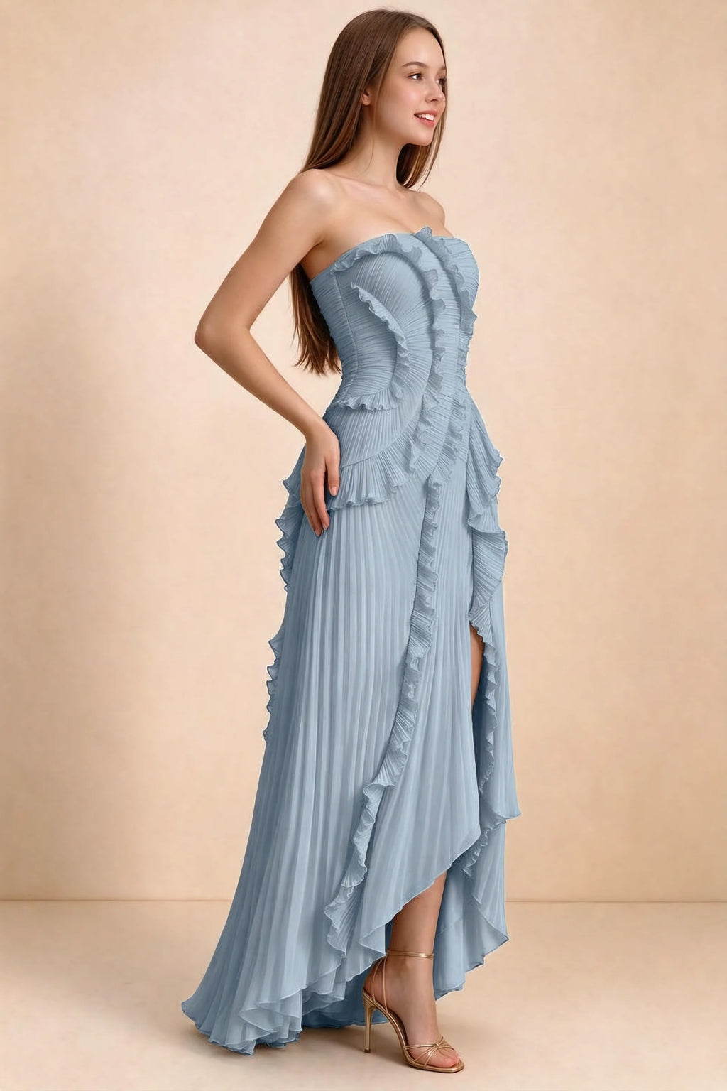 Three-quarter studio view of Camilla dusty blue dress showing the defined waist and asymmetric leg opening