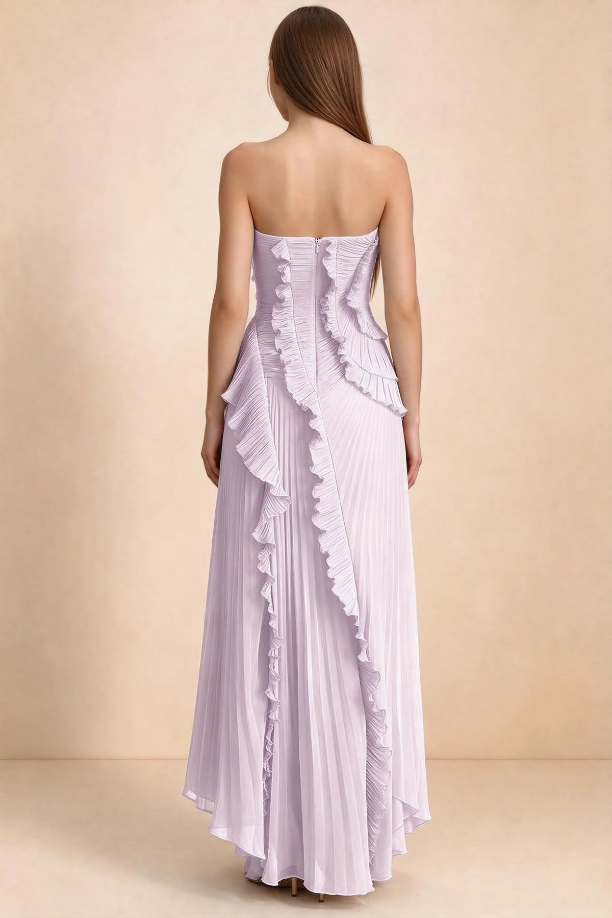 Rear studio view of Camilla lilac dress showing curved ruffle layers and a long pleated skirt