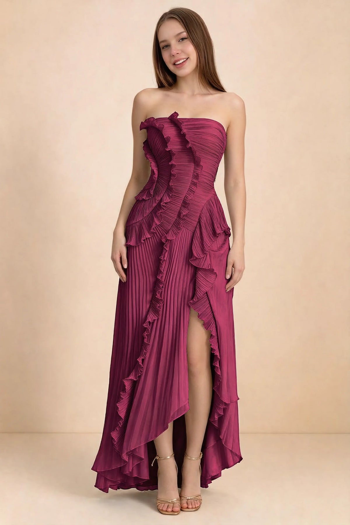 Front studio view of Camilla merlot strapless maxi dress with pleats, cascading ruffles and an asymmetric opening