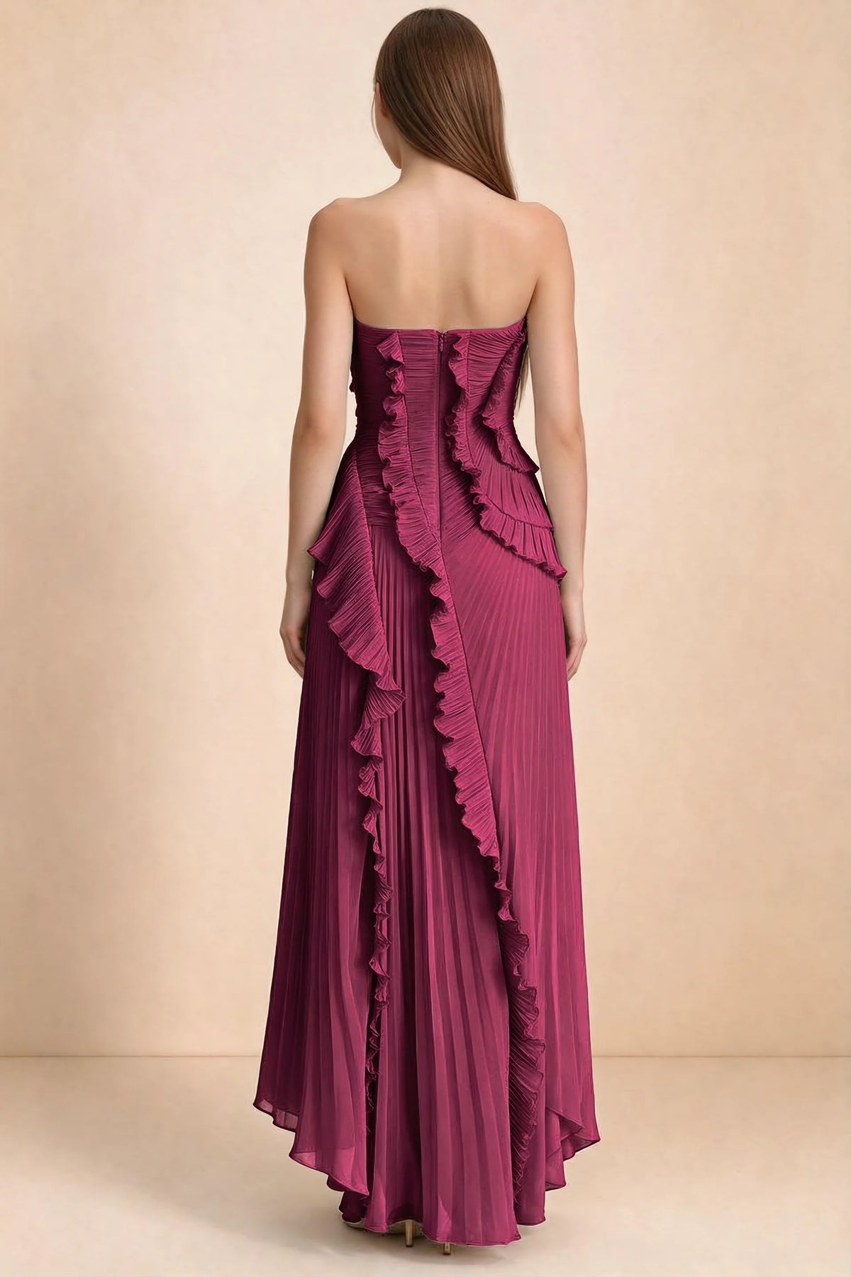 Rear studio view of Camilla merlot dress showing curved ruffle layers and a long pleated skirt