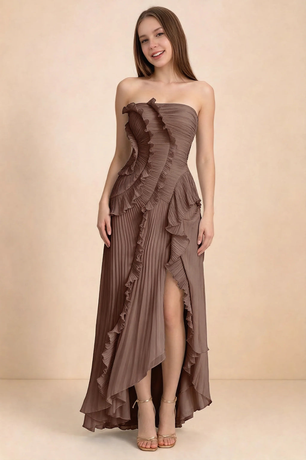 Front studio view of Camilla mocha strapless maxi dress with pleats, cascading ruffles and an asymmetric opening