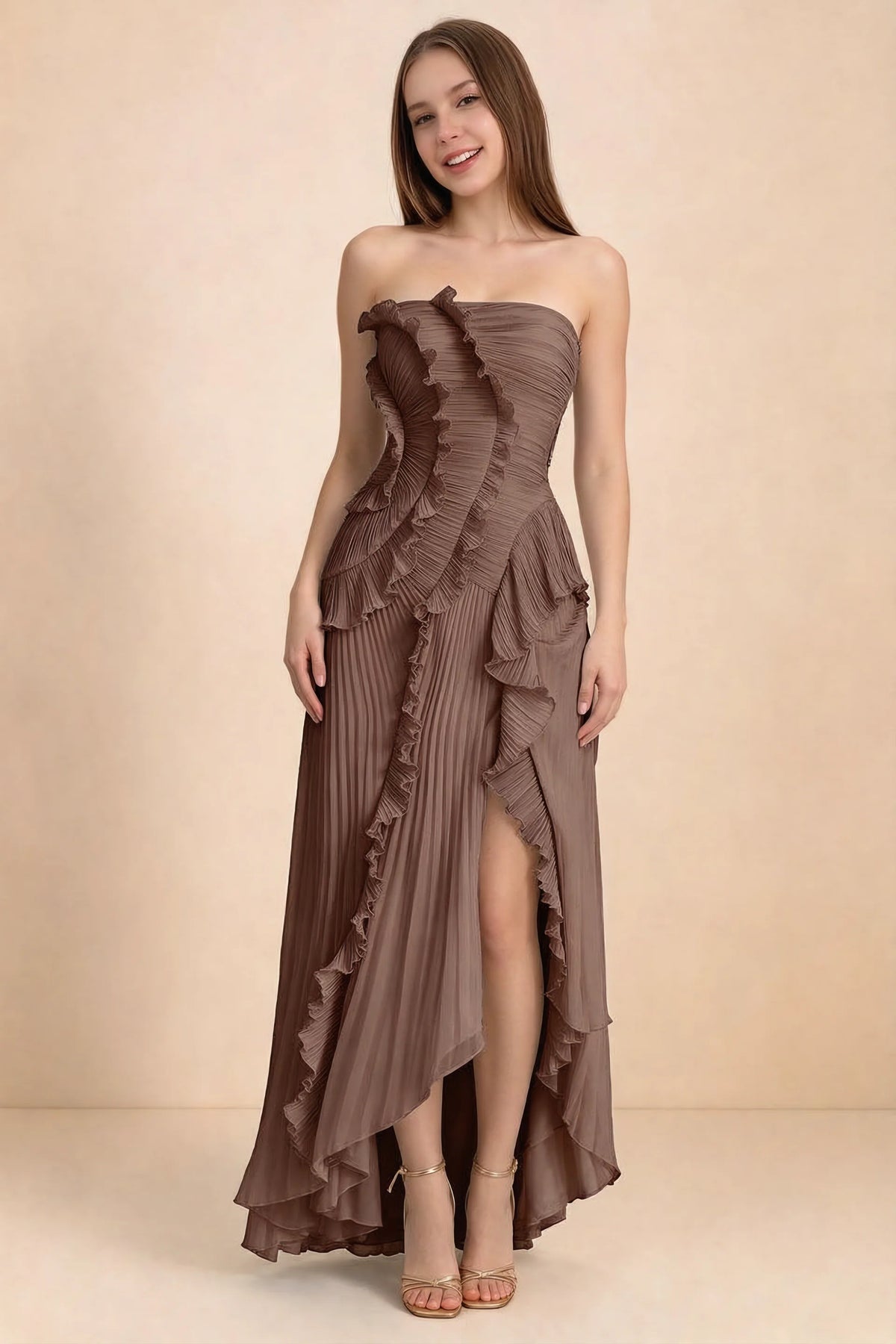 Front studio view of Camilla mocha strapless maxi dress with pleats, cascading ruffles and an asymmetric opening