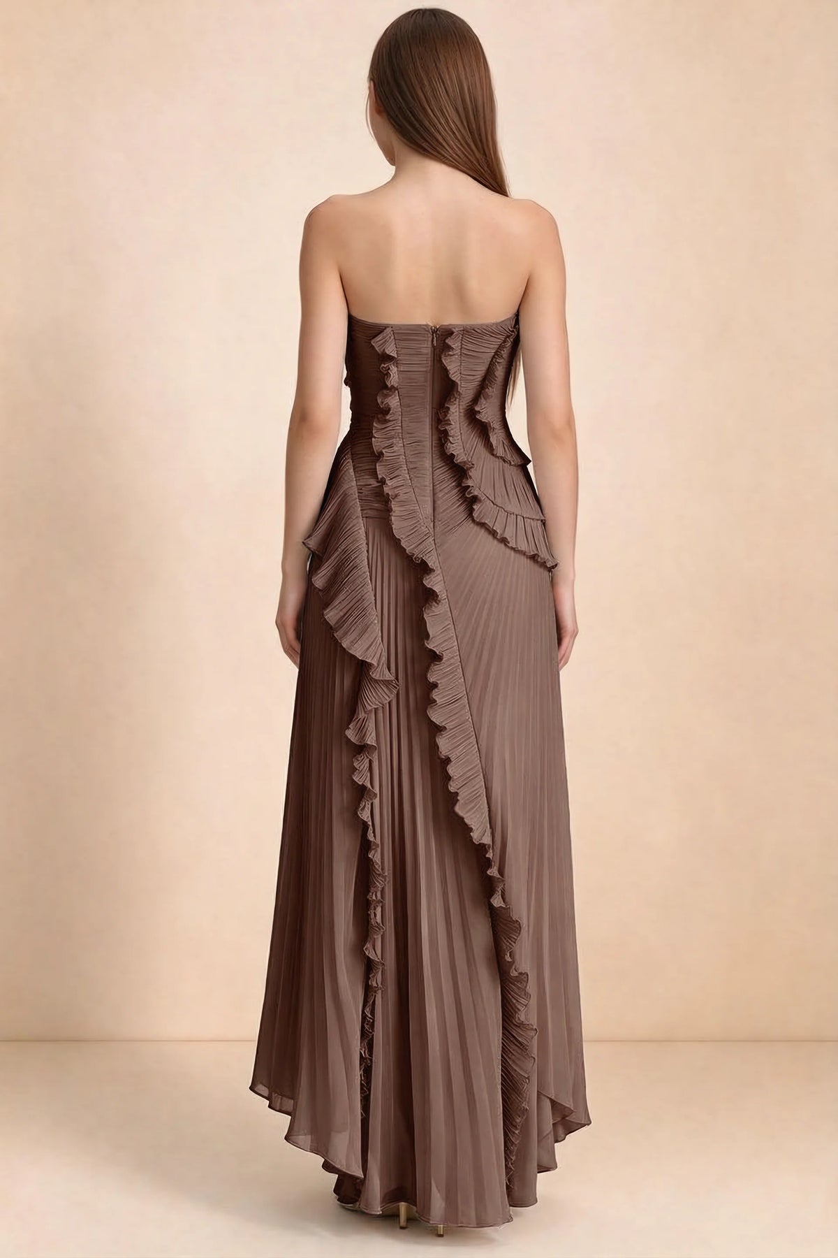 Rear studio view of Camilla mocha dress showing curved ruffle layers and a long pleated skirt
