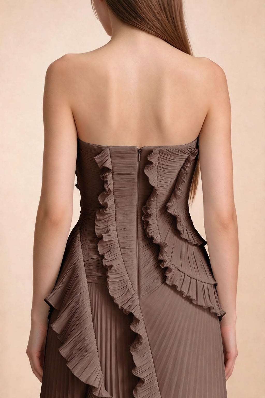 Close-up of Camilla mocha back bodice, centre-back zipper and curved ruffle edges
