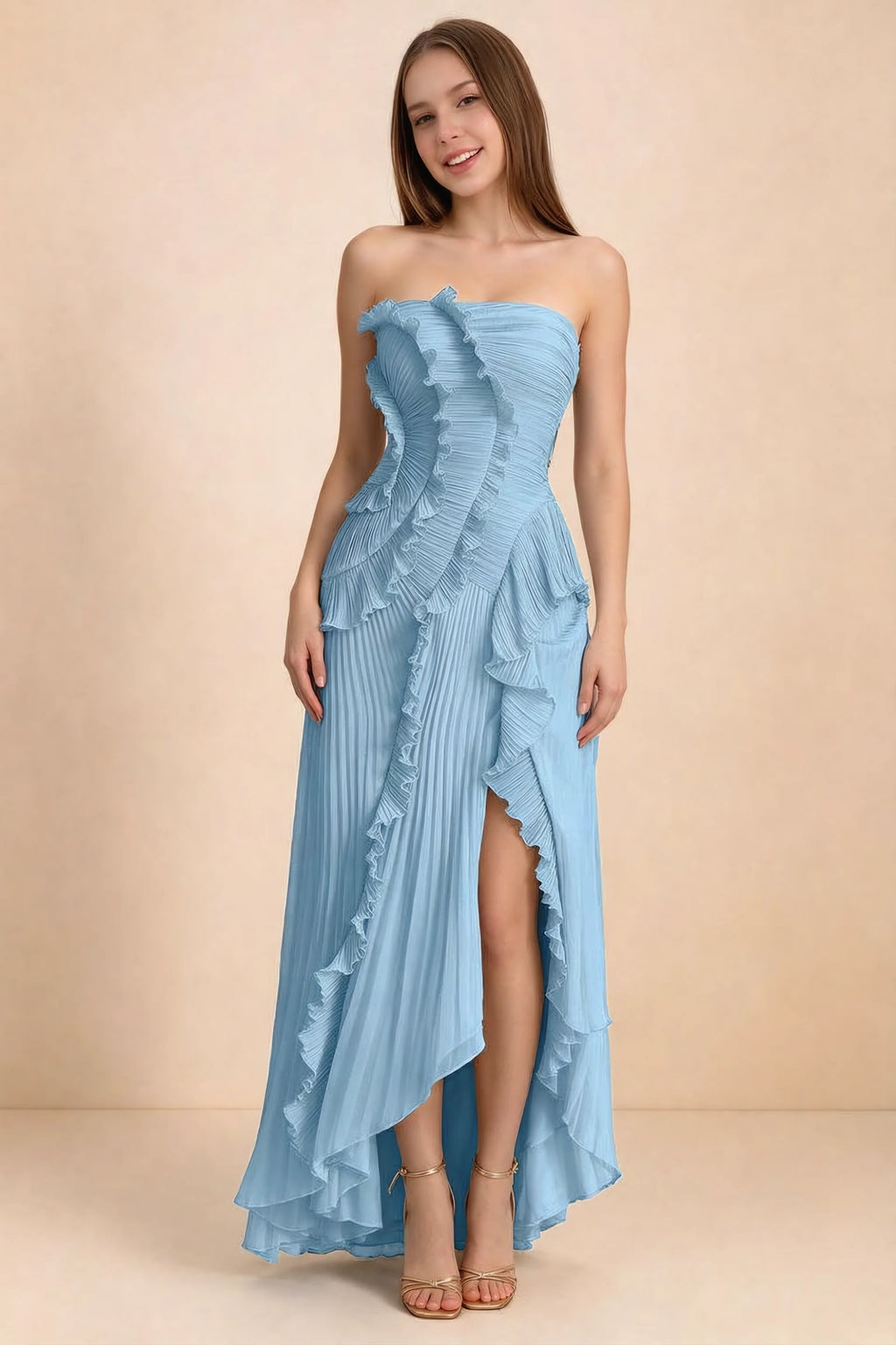 Front studio view of Camilla steel blue strapless maxi dress with pleats, cascading ruffles and an asymmetric opening