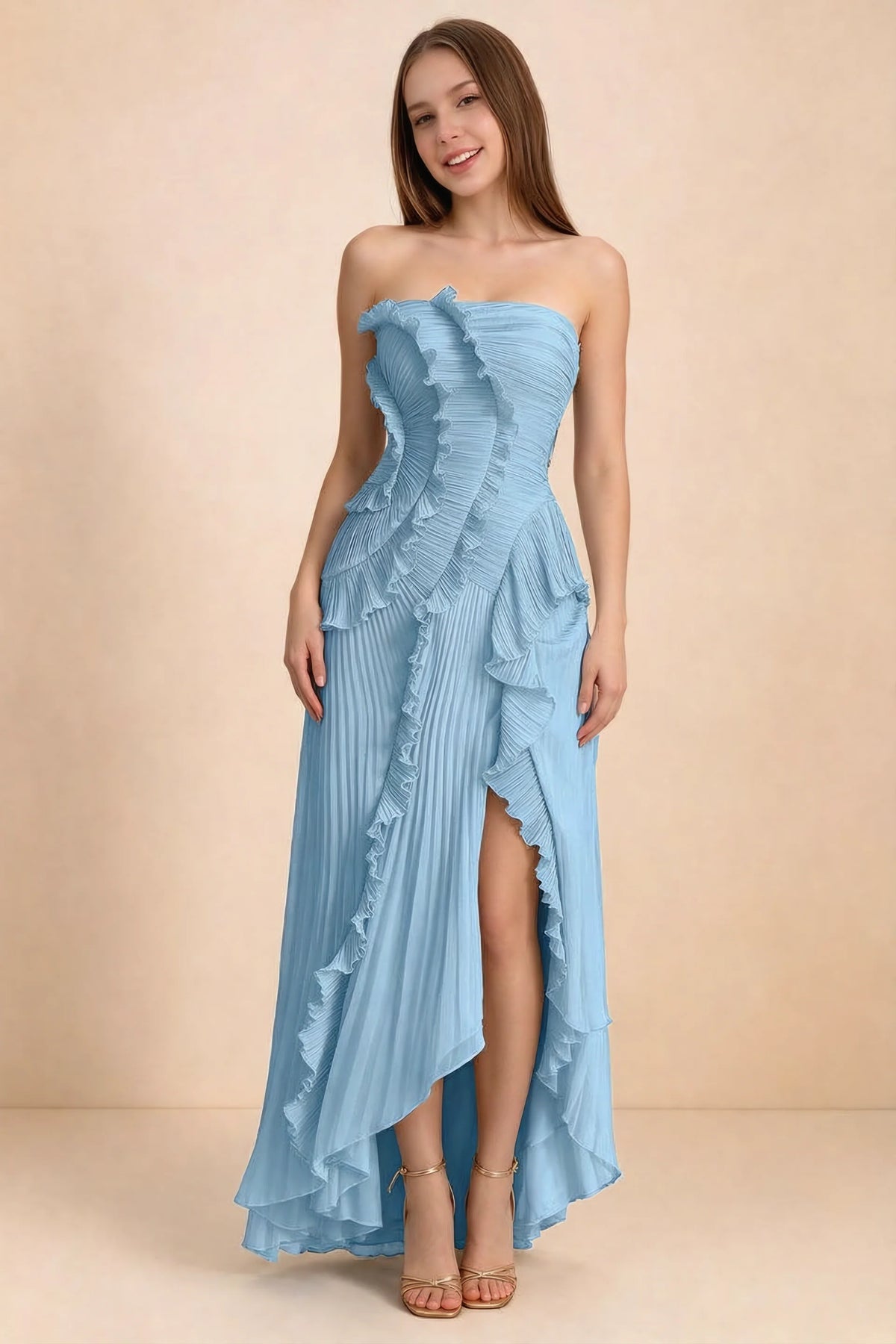 Front studio view of Camilla steel blue strapless maxi dress with pleats, cascading ruffles and an asymmetric opening