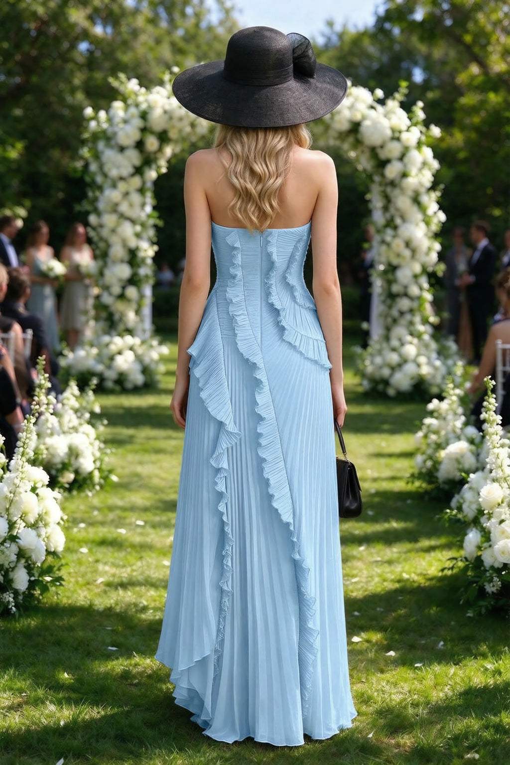 Outdoor rear view of Camilla steel blue dress showing the layered ruffles and long back hem