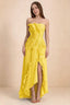 Front studio view of Camilla yellow strapless maxi dress with pleats, cascading ruffles and an asymmetric opening