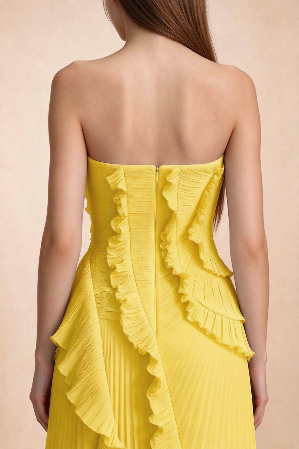 Close-up of Camilla yellow back bodice, centre-back zipper and curved ruffle edges