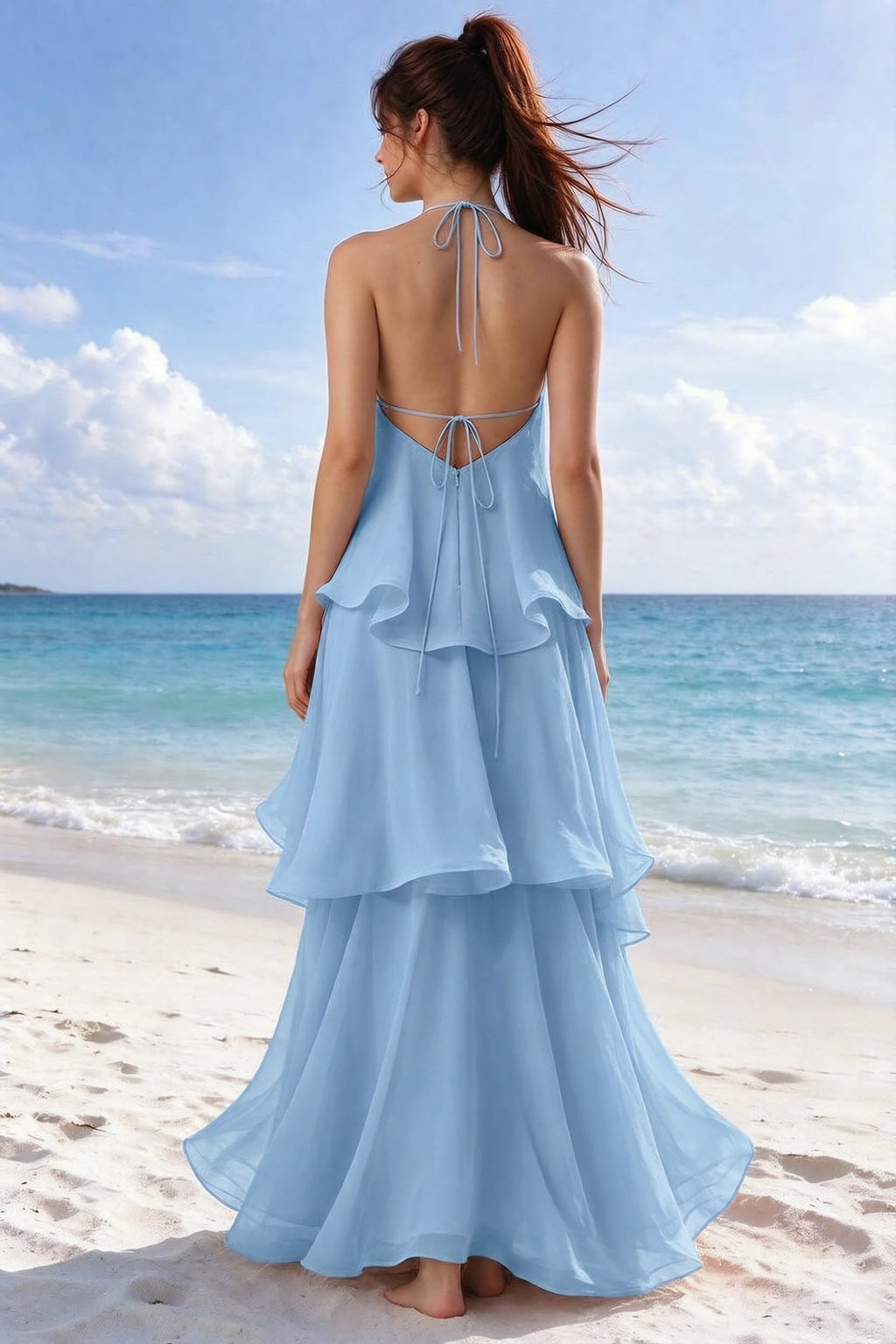 Beachside rear view of Candace steel blue dress showing the open back and overlapping ruffle layers