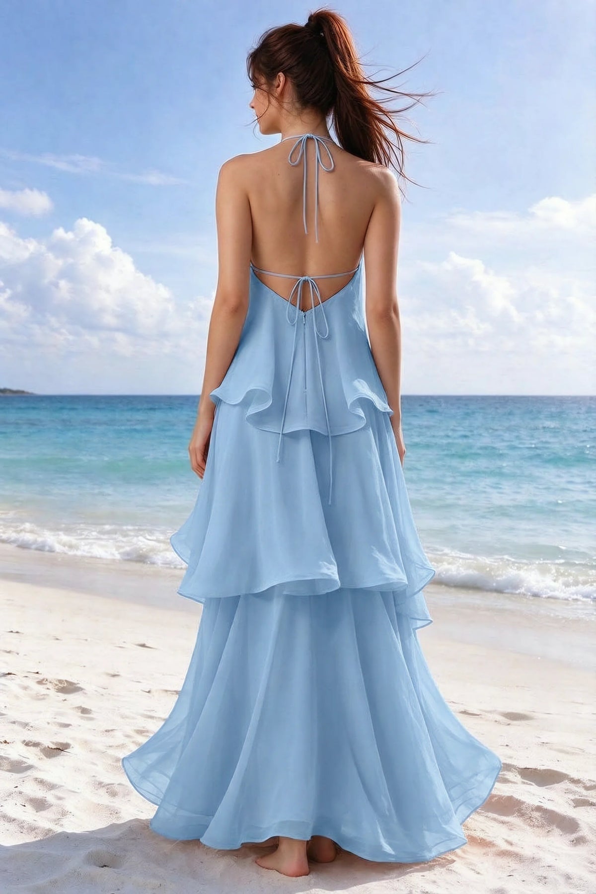 Beachside rear view of Candace steel blue dress showing the open back and overlapping ruffle layers