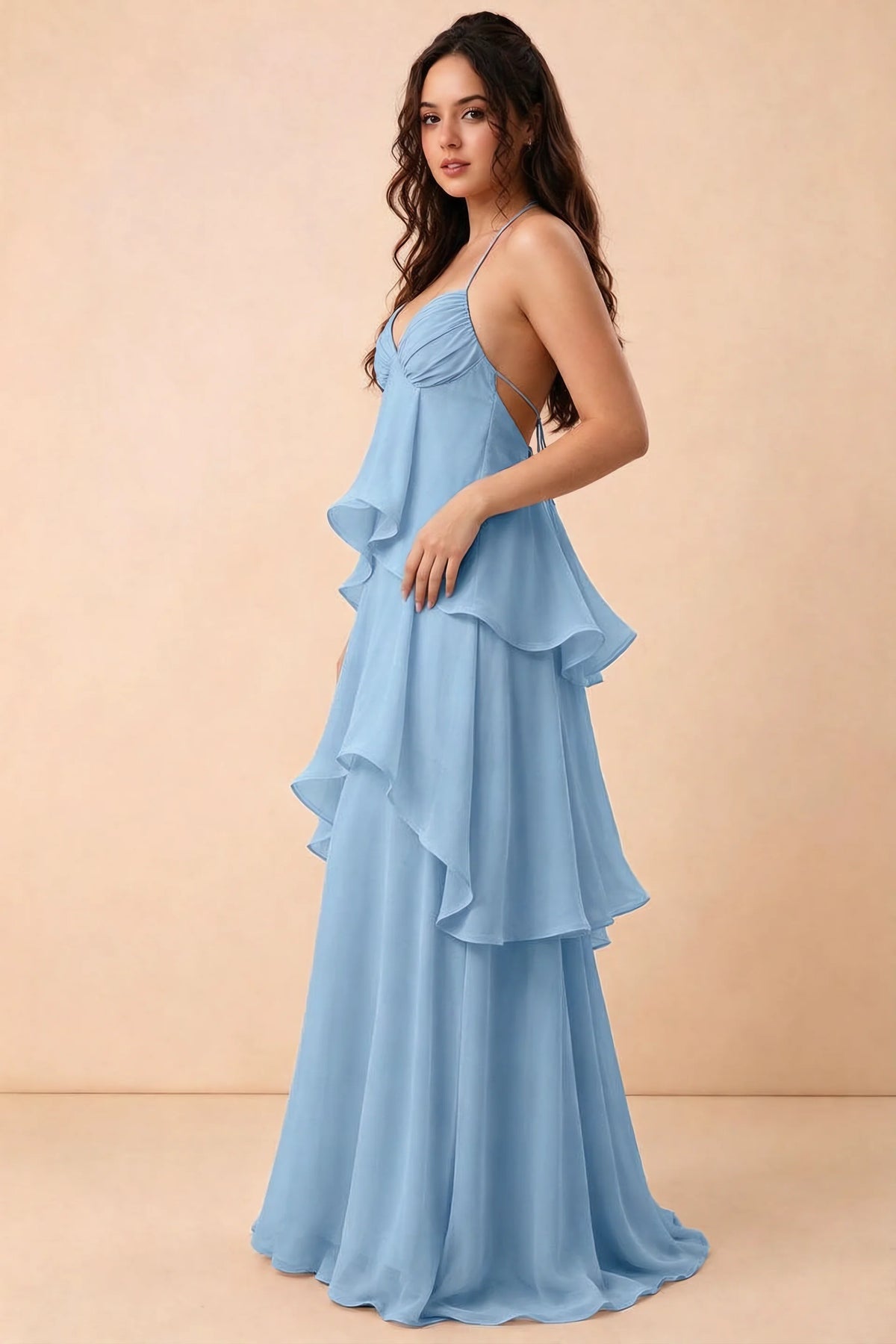 Three-quarter studio view of Candace steel blue dress showing the halter neckline and tiered silhouette