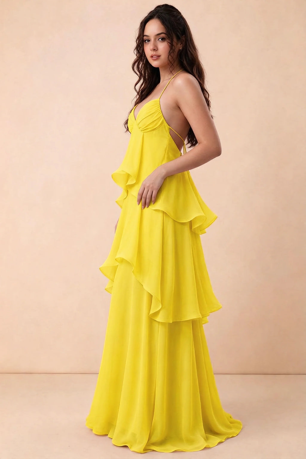Three-quarter studio view of Candace yellow dress showing the halter neckline and tiered silhouette