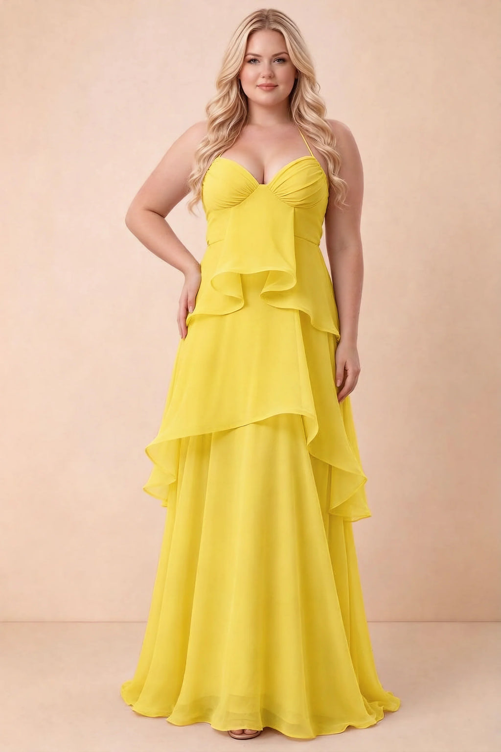 Front studio view of Candace yellow dress on a second model, showing the gathered bust and broad ruffles