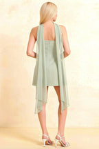 Back view of elegant Candice mini dress in sage green, featuring an open back design and long chiffon scarf details for club and party wear.