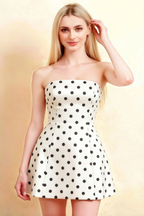 Studio shot of LVLVS Candice white polka dot strapless dress with high neck scarf accessory