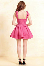 Back view of LVLVS Cassandra hot pink stretch crepe dress with bow straps and open back for formal event