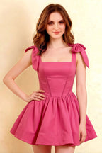 Close up of LVLVS Cassandra hot pink bow shoulder straps dress with square neckline for party wear