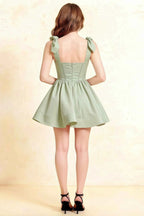 Back View of LVLVS Cassandra Sage Green Dress: Open Back Bow Detail Stretch Crepe Homecoming Dress