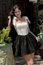 Customer photo of LVLVS Cassandra white and black bow straps mini skater dress worn to summer garden brunch