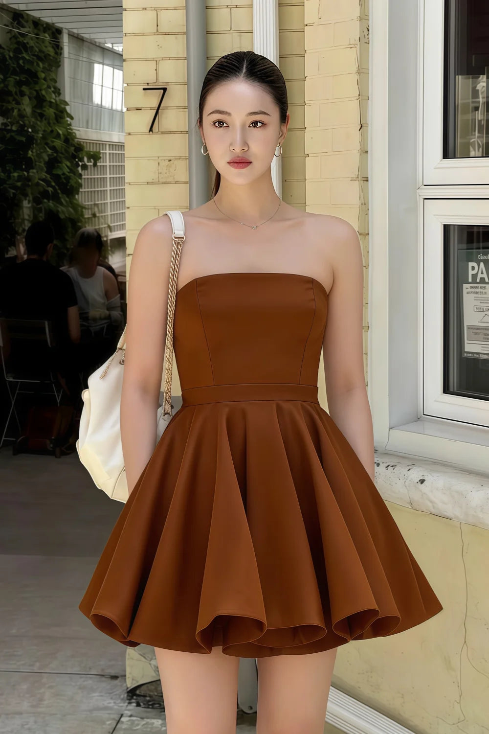 Customer photo of LVLVS chocolate Catherine bandeau dress styled for brunch and casual street style, effortlessly chic bonded crepe mini skater dress.
