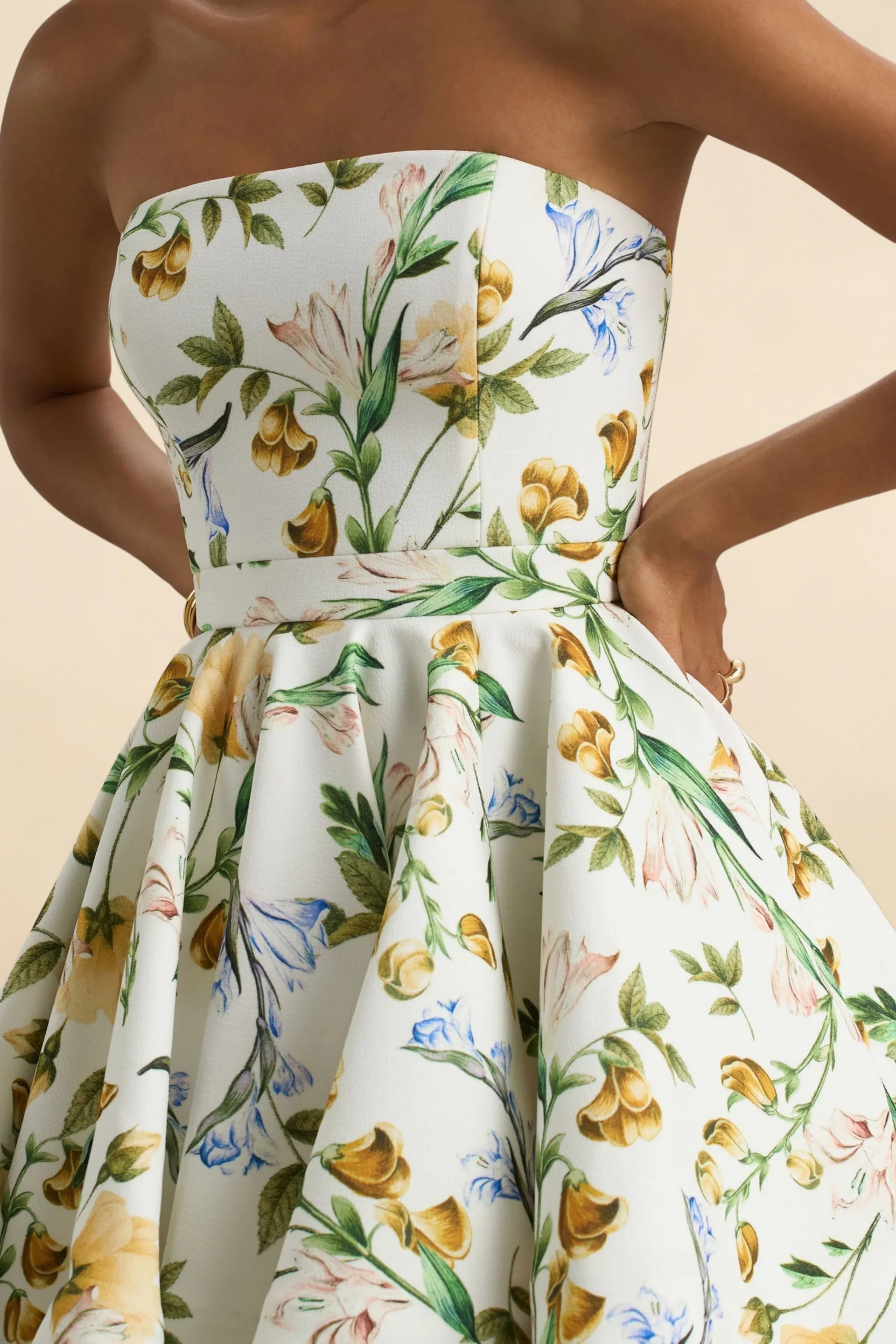 Close Up of LVLVS Catherine Green and White Floral Print Bandeau Ruffle Mini Dress Waist Detail in Bonded Crepe