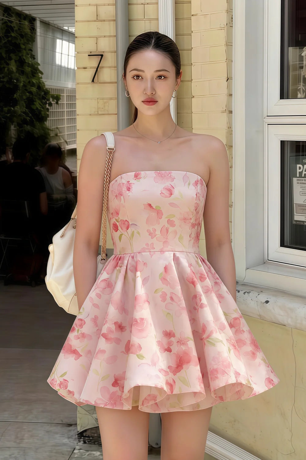 Real customer wearing the LVLVS Catherine light pink floral print dress for a casual coffee shop outing in the city