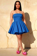 Plus Size Model in LVLVS Catherine Royal Blue Bandeau Ruffle Mini Dress - Inclusive Sizing for Curvy Figures, Trendy Puff Skirt & Strapless Design for Club Nights, Parties, or Going Out