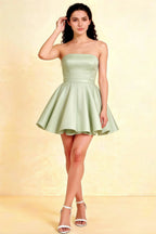 LVLVS Sage Green Catherine Bandeau Ruffle Mini Dress in studio photoshoot, featuring bonded crepe texture and flared A-line silhouette, perfect for cocktail party or bridal shower events.