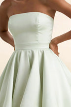 Detail view of LVLVS Sage Green Catherine dress highlighting the clean bandeau top design and high-quality bonded crepe material, versatile for both office wear and cocktail parties.