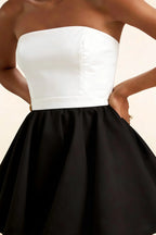 Detailed close-up of the LVLVS Catherine white and black bandeau dress waistband and structured bustier, made from high-quality bonded crepe fabric for a classy look.