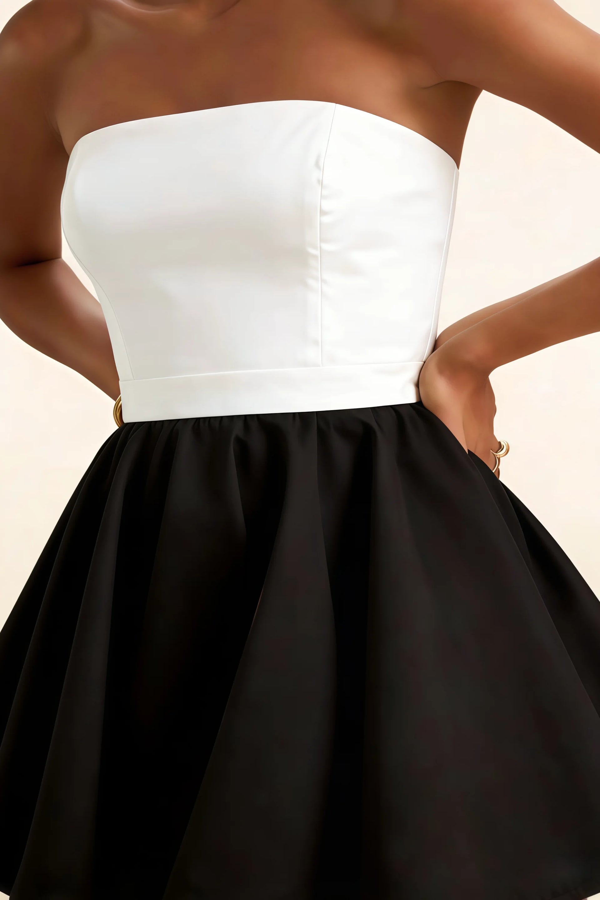 Detailed close-up of the LVLVS Catherine white and black bandeau dress waistband and structured bustier, made from high-quality bonded crepe fabric for a classy look.