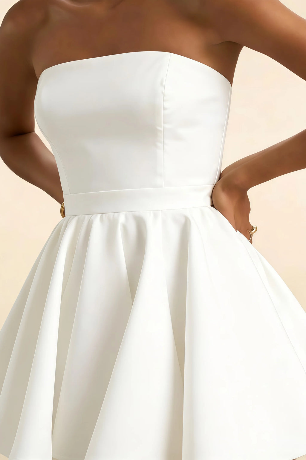 Close up detail of white bonded crepe Catherine dress highlighting smooth fabric texture and clean lines.