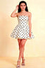 LVLVS White Polka Dot Catherine Bandeau Ruffle Mini Dress for Cocktail Parties and Dates, elegant strapless fit and flare silhouette on model, studio shot.
