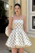 Customer wearing LVLVS White Polka Dot Catherine Bandeau Ruffle Mini Dress for brunch and casual outings, stylish real-life look on the street.