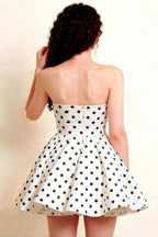 Back view of LVLVS Catherine White Polka Dot Bandeau Mini Dress highlighting gathered waistband and flowy skirt, ideal for club and dance events.