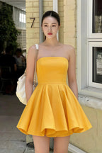 Real customer wearing LVLVS yellow Catherine bandeau dress for city street style and brunch occasions