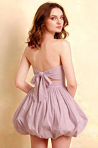 Side Back View LVLVS Cathy Lilac Strapless Puff Ball Mini Dress With Back Bow Ruched Stretch Cotton Poplin For Bridesmaid Wedding Dance Formal Event Half Body Studio Shot