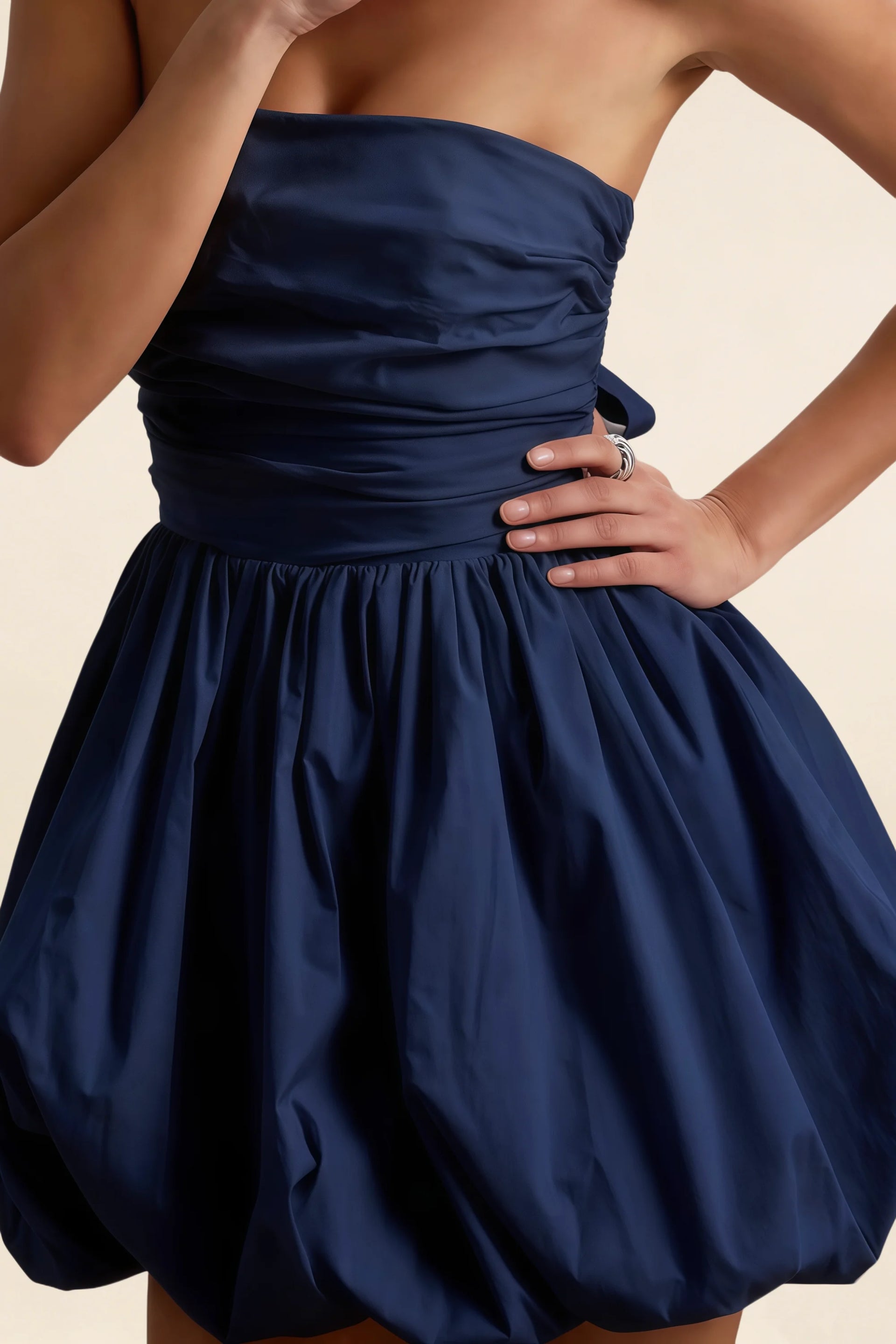 Detail Shot of LVLVS Cathy Navy Dress Highlighting Ruching Waistband and Puff Ball Silhouette for Classy Casual Wear