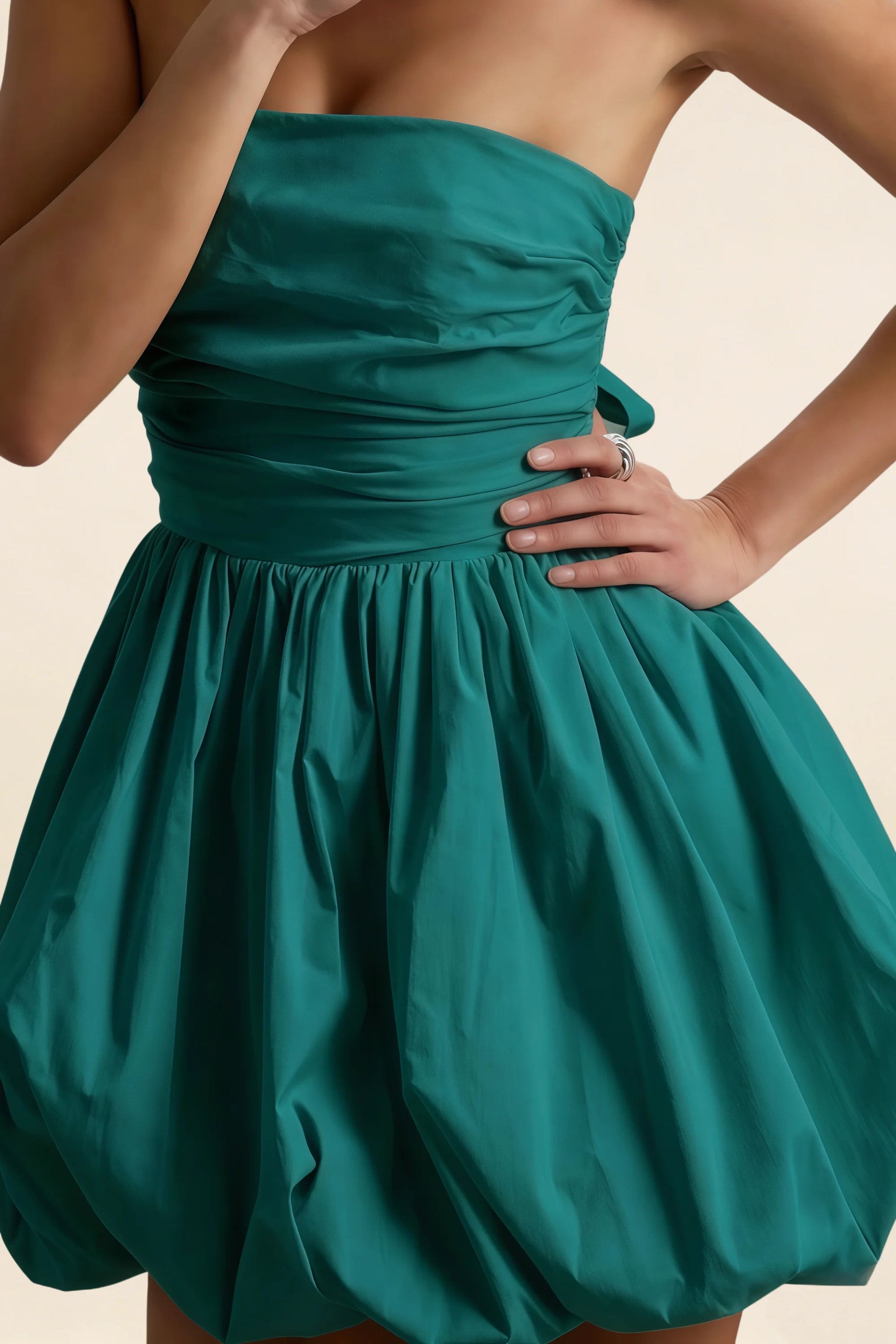 Detail shot of LVLVS Cathy peacock puff ball dress highlighting stretch cotton poplin texture and ruched waist for club and going out wear