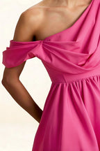 Close Up of LVLVS Cecilia Hot Pink Crepe Fabric and Draped Asymmetric Neckline Detail for Prom and Special Occasions