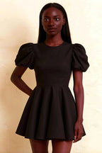Close up fit and flare silhouette of LVLVS Celia black dress with cinched waist perfect for semi-formal events