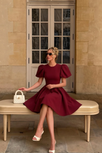 LVLVS Celia Burgundy Crew Neck Mini Dress Styled for Brunch or Day Party with Handbag and Heels
