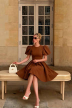 Customer in LVLVS Celia Coffee Stretch Crepe Dress for City Sightseeing, Brunch Dates & Semi - Formal Occasions - Elegant Puff Sleeve Mini Dress with White Handbag