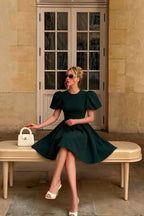 Customer Styled LVLVS Celia Emerald Green Puff Sleeve Mini Dress Sitting on Bench for City Sightseeing Classy Day Out