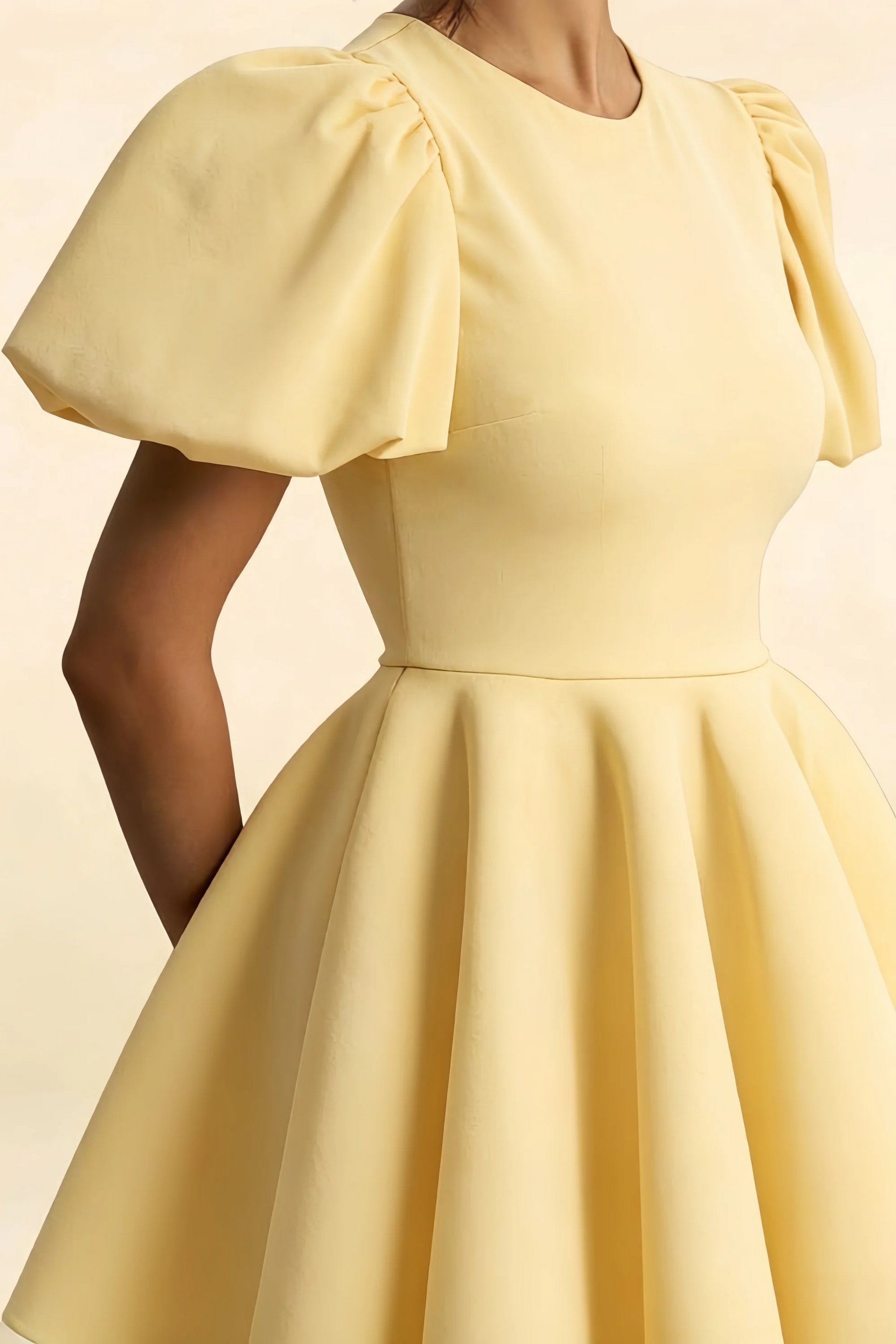 Close Up Detail of LVLVS Celia Lemon Puff Sleeve Mini Dress, Textured Stretch Crepe Fabric and Gathered Sleeve Design for Cocktail Parties and Birthdays