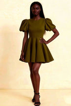 Olive green LVLVS Celia stretch crepe mini dress with puff sleeves and flared A-line skirt, studio full body shot for cocktail party.